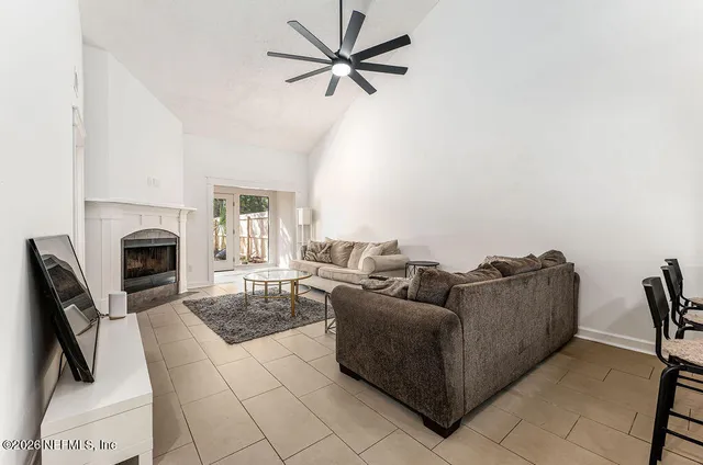a living room with furniture and a fireplace