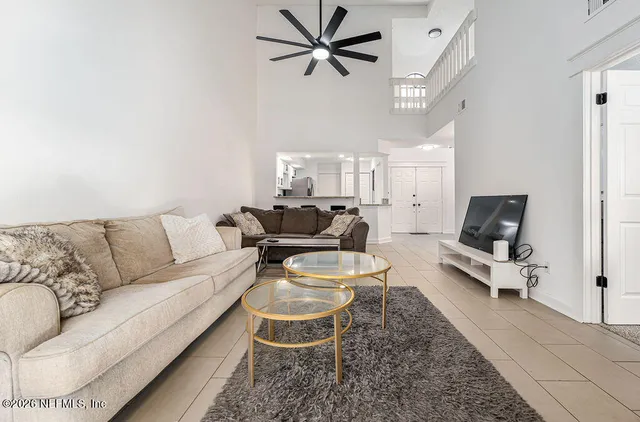 a living room with furniture and a rug