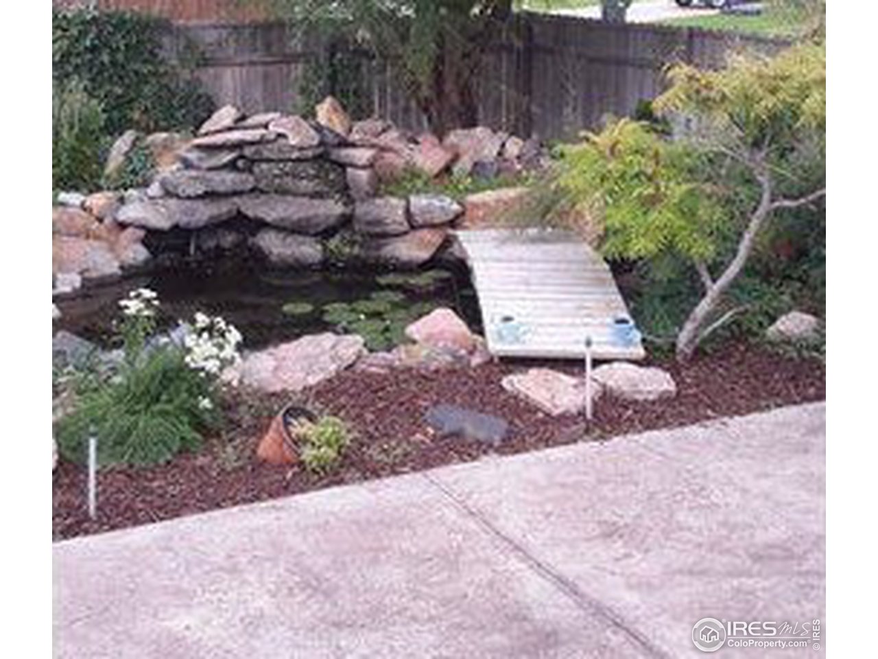 1821 Robin Road Sterling, CO 80751 - Photo 12 of 12 a view of a backyard with plants and flowers