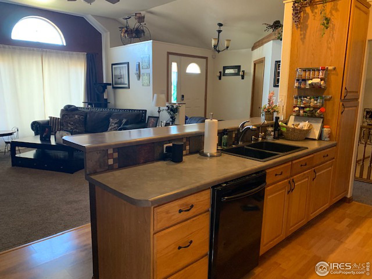 1821 Robin Road Sterling, CO 80751 - Photo 5 of 12 a kitchen with a sink and cabinets