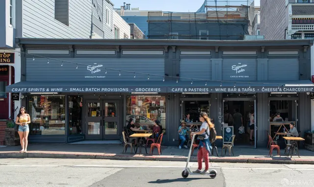 a view of a cafe with sitting area
