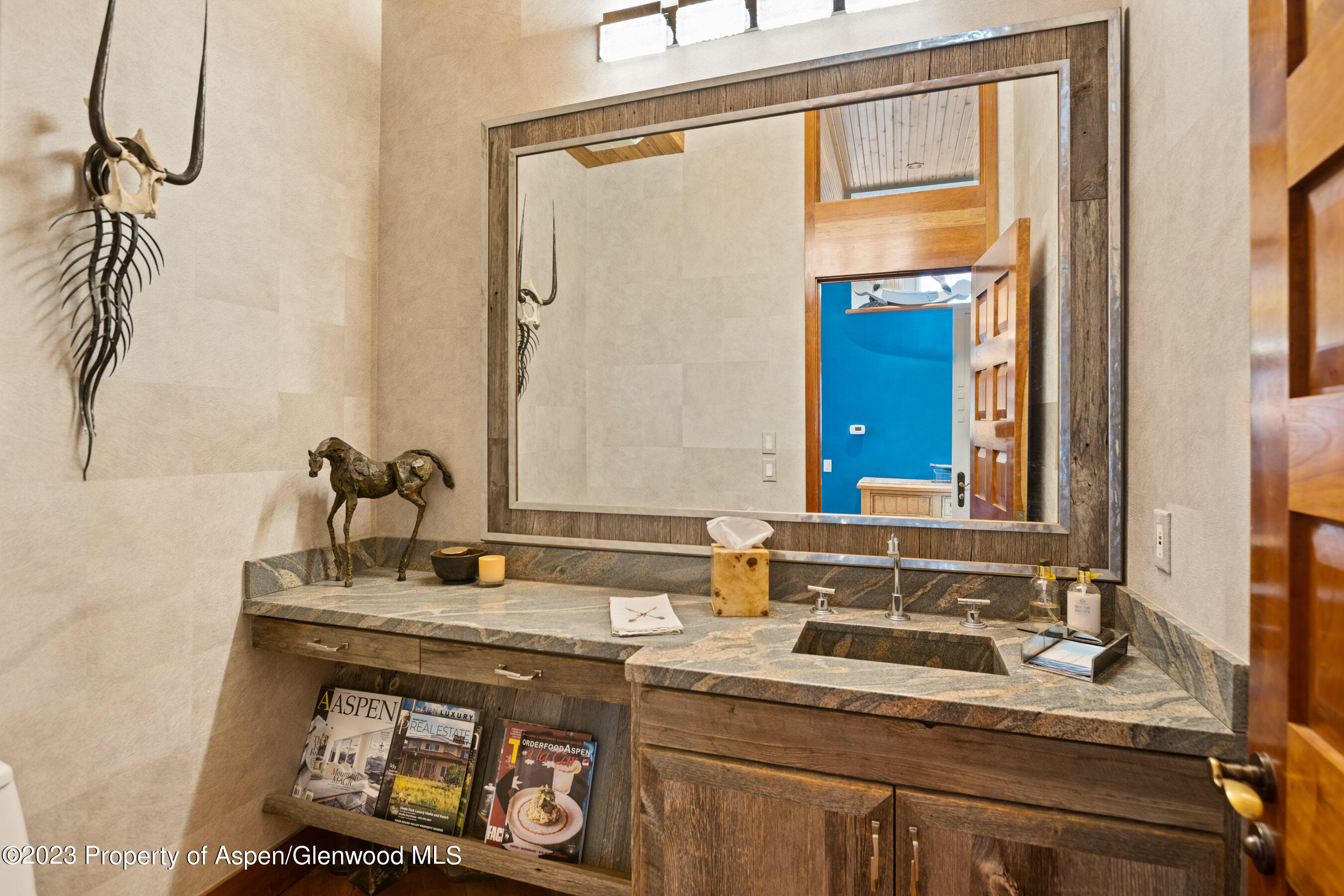 1402 Crystal Lake Road Aspen, CO 81611 - Photo 19 of 22 a bathroom with a sink and a mirror