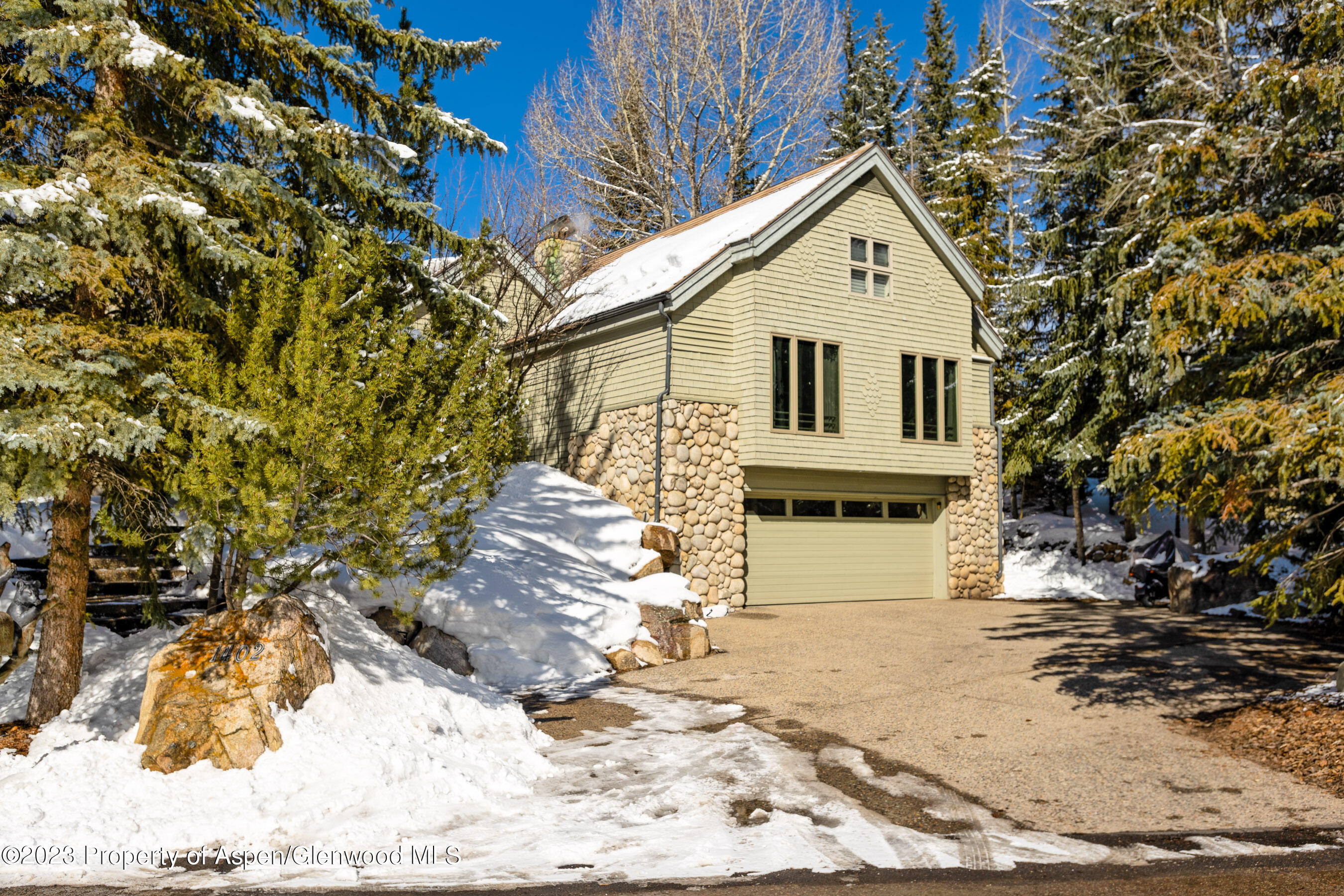 1402 Crystal Lake Road Aspen, CO 81611 - Photo 22 of 22 a front view of a house with a yard