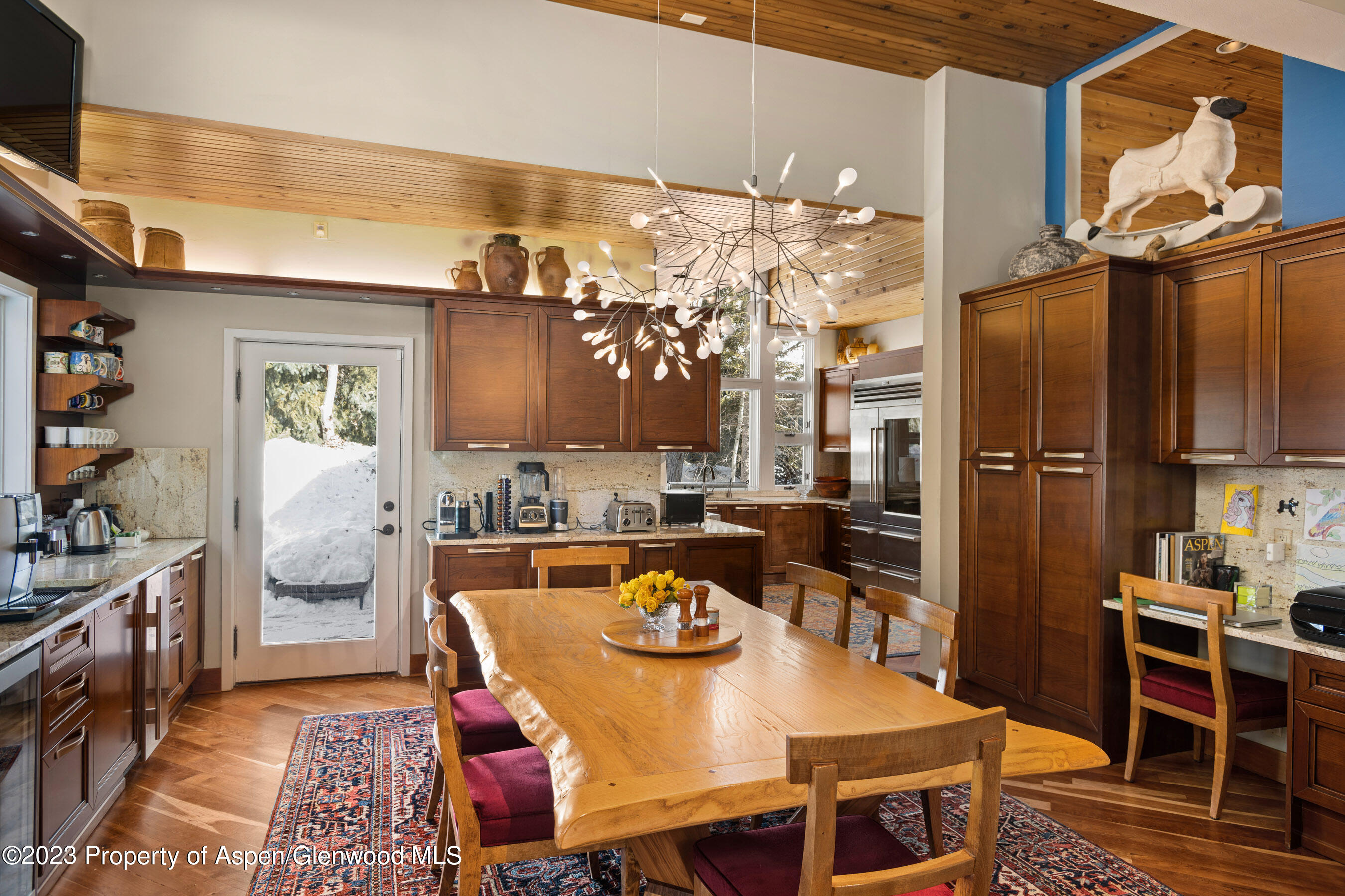 1402 Crystal Lake Road Aspen, CO 81611 - Photo 9 of 22 a view of a dining room with furniture and chandelier
