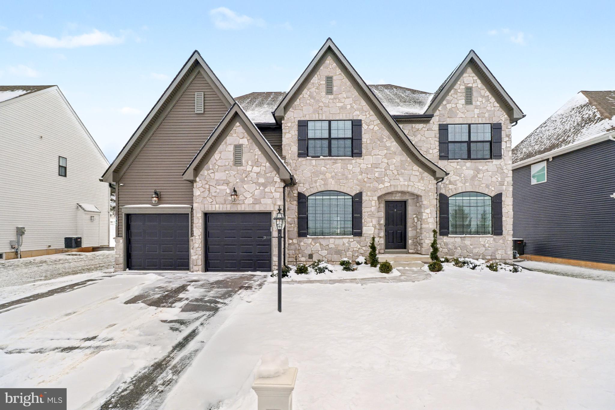 a view of a house with snow on the background