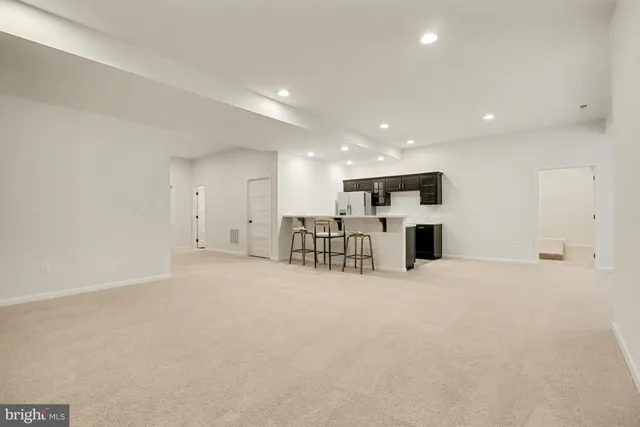 a kitchen with a sink appliances and cabinets