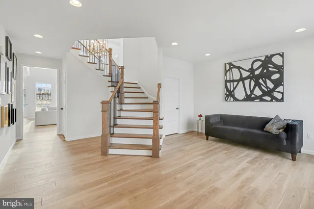 a view of a livingroom with furniture and wooden floor