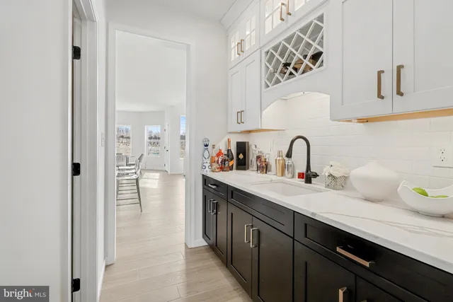 a kitchen with sink and cabinets