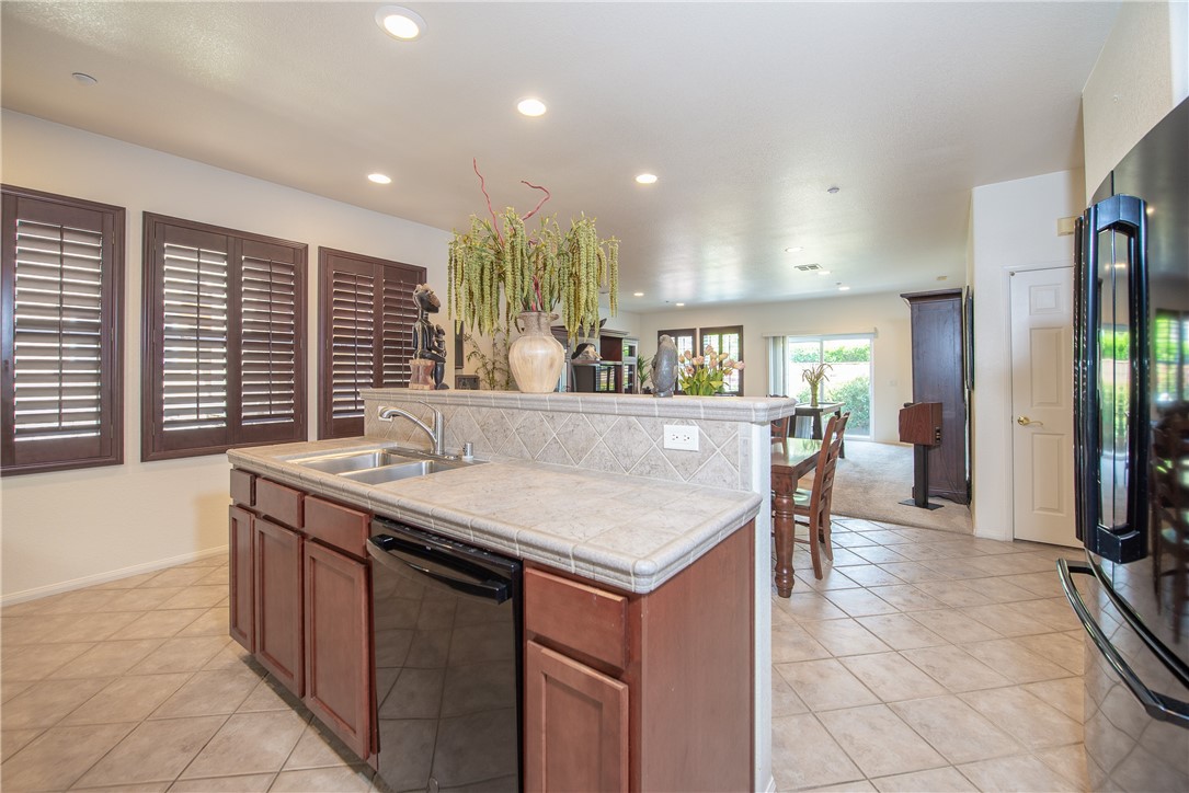 7353 Ellena W, Unit 52 Rancho Cucamonga, CA 91730 - Photo 11 of 30 The spacious open concept great room is perfect for everyday living and entertaining.