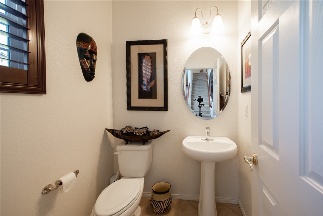 7353 Ellena W, Unit 52 Rancho Cucamonga, CA 91730 - Photo 12 of 30 The downstairs half bath is at the bottom of the stairs and has nice sized closet for extra storage.