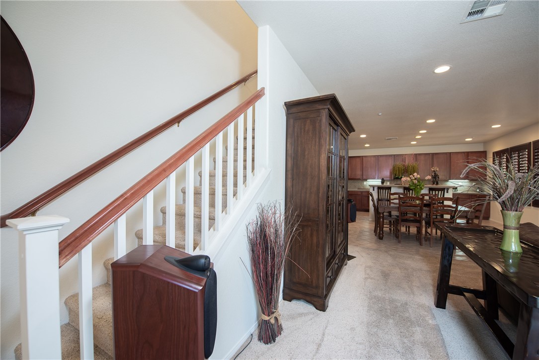 7353 Ellena W, Unit 52 Rancho Cucamonga, CA 91730 - Photo 13 of 30 The stairway is on the side of the living room.