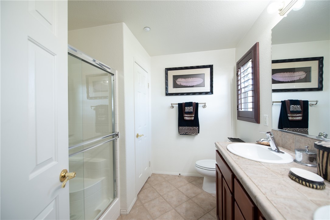 7353 Ellena W, Unit 52 Rancho Cucamonga, CA 91730 - Photo 17 of 30 The spotless ensuite has a separate bathtub and shower.