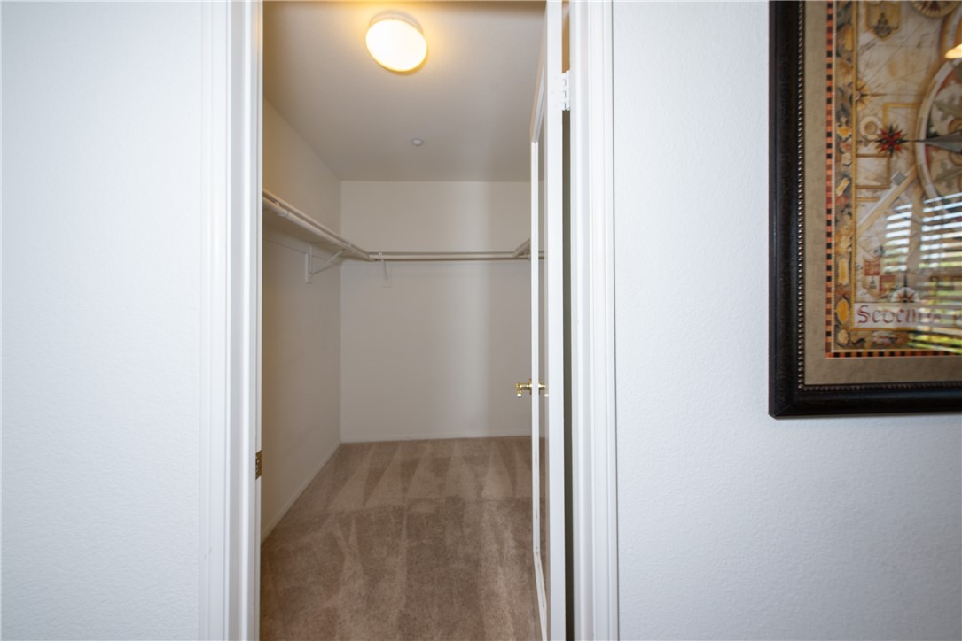 7353 Ellena W, Unit 52 Rancho Cucamonga, CA 91730 - Photo 18 of 30 There is plenty of room in the primary walk-in closet.