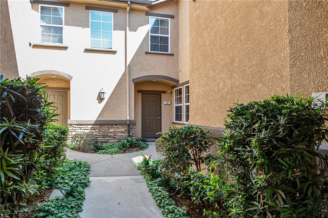 7353 Ellena W, Unit 52 Rancho Cucamonga, CA 91730 - Photo 2 of 30 Enter through the beautifully landscaped courtyard to the front door on the right.