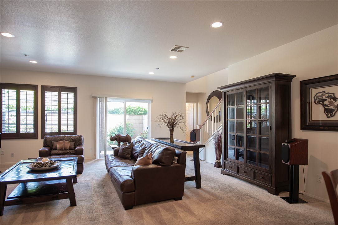 7353 Ellena W, Unit 52 Rancho Cucamonga, CA 91730 - Photo 4 of 30 The rich dark wood plantation shutters are throughout most of the interior.