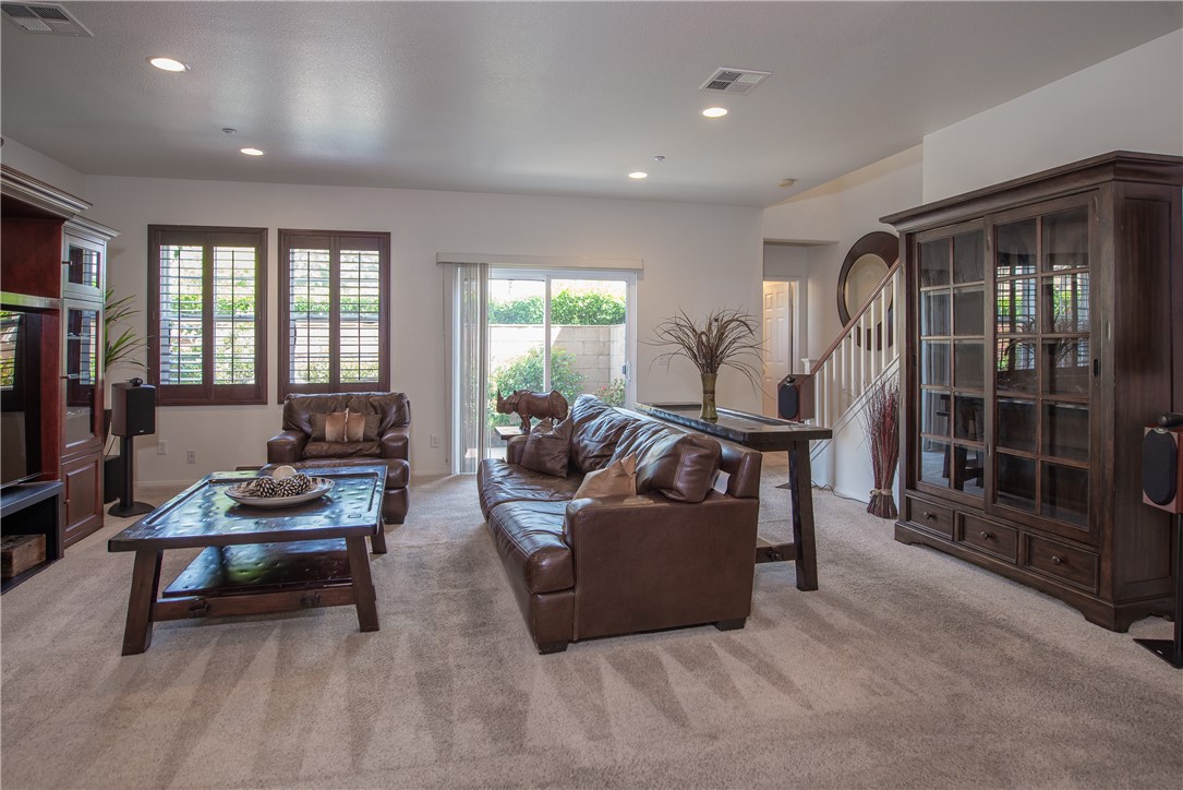 7353 Ellena W, Unit 52 Rancho Cucamonga, CA 91730 - Photo 5 of 30 Enjoy the soft eastern morning light through the windows of the living room.