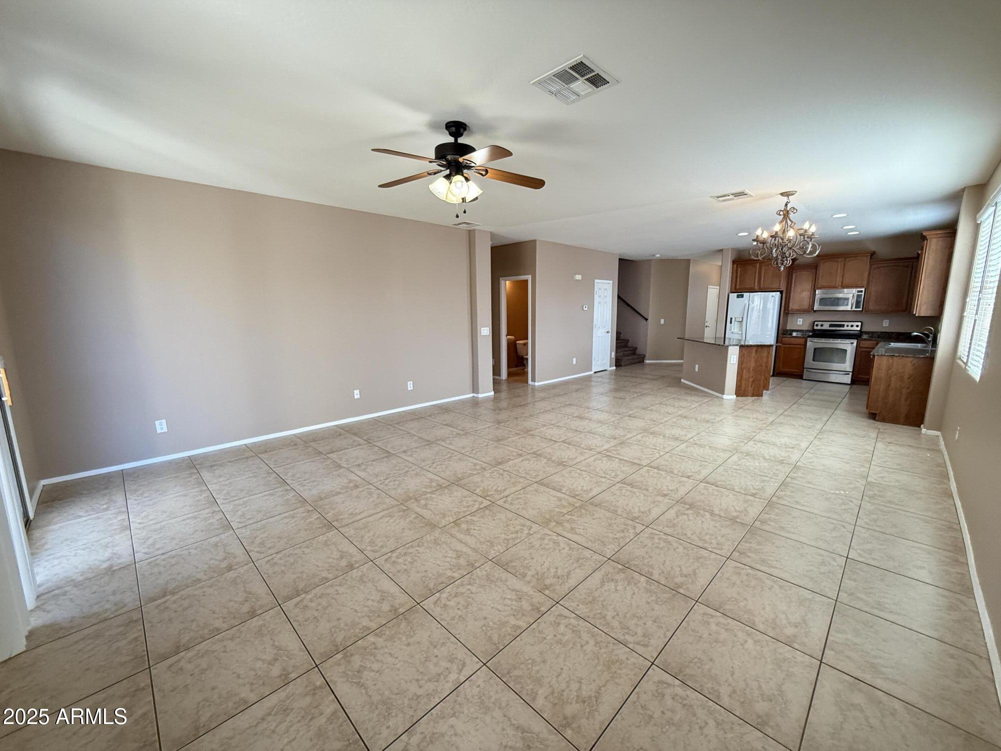 11752 West Foothill Drive Sun City, AZ 85373 - Photo 11 of 48 a view of a livingroom with a furniture and chandelier fan
