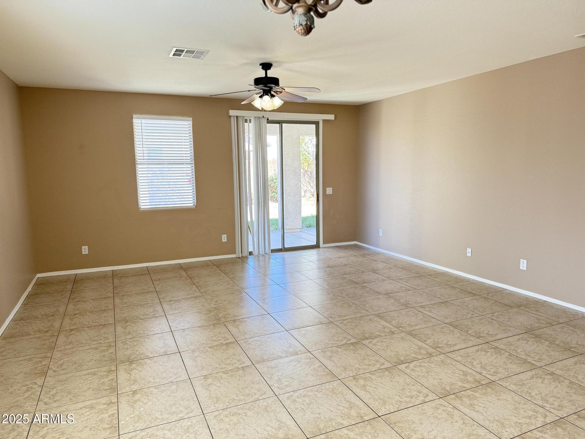 11752 West Foothill Drive Sun City, AZ 85373 - Photo 14 of 48 a view of an empty room with a window