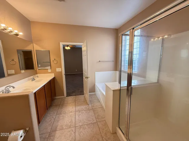 a kitchen with a refrigerator and a sink