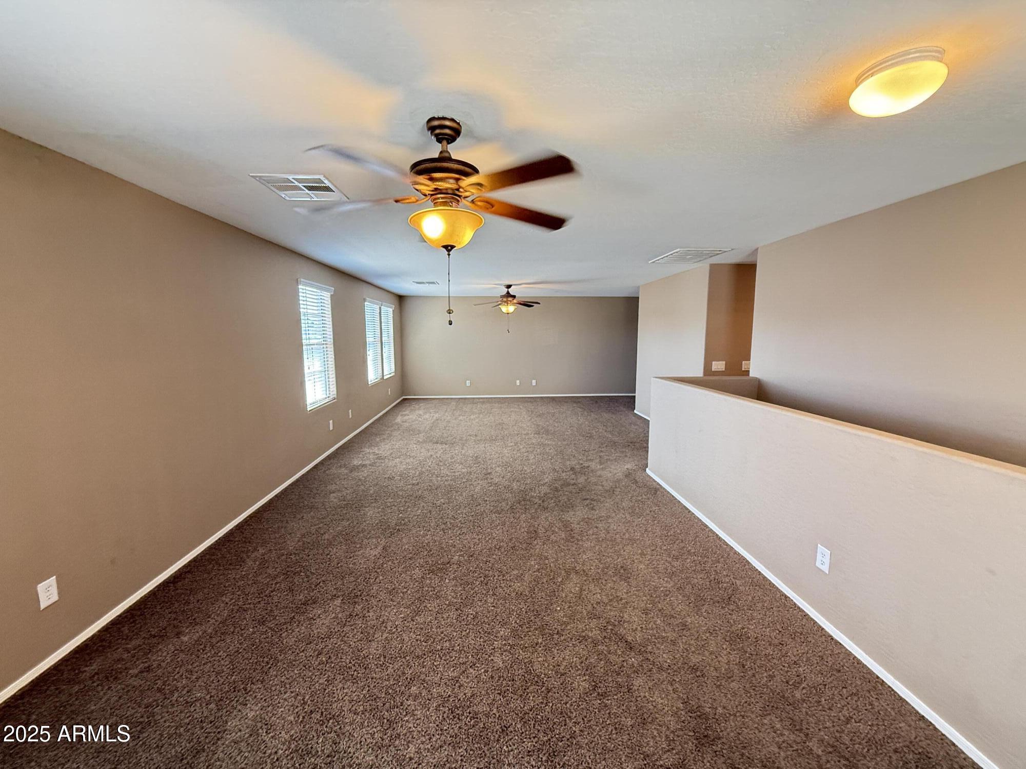 11752 West Foothill Drive Sun City, AZ 85373 - Photo 26 of 48 a view of a livingroom with a fireplace and window