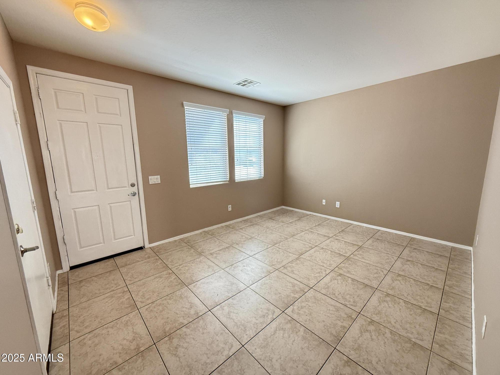 11752 West Foothill Drive Sun City, AZ 85373 - Photo 3 of 48 a view of an empty room with a window