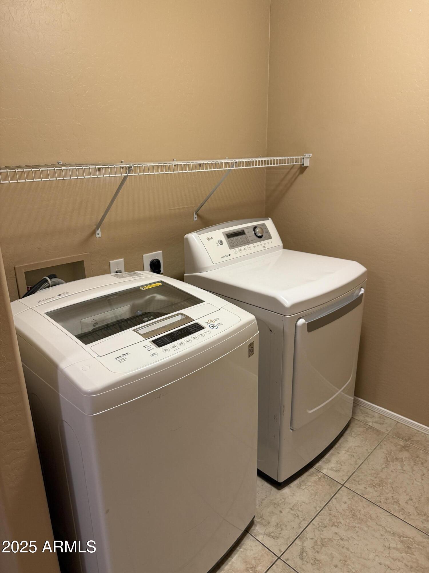 11752 West Foothill Drive Sun City, AZ 85373 - Photo 35 of 48 a utility room with dryer and washer
