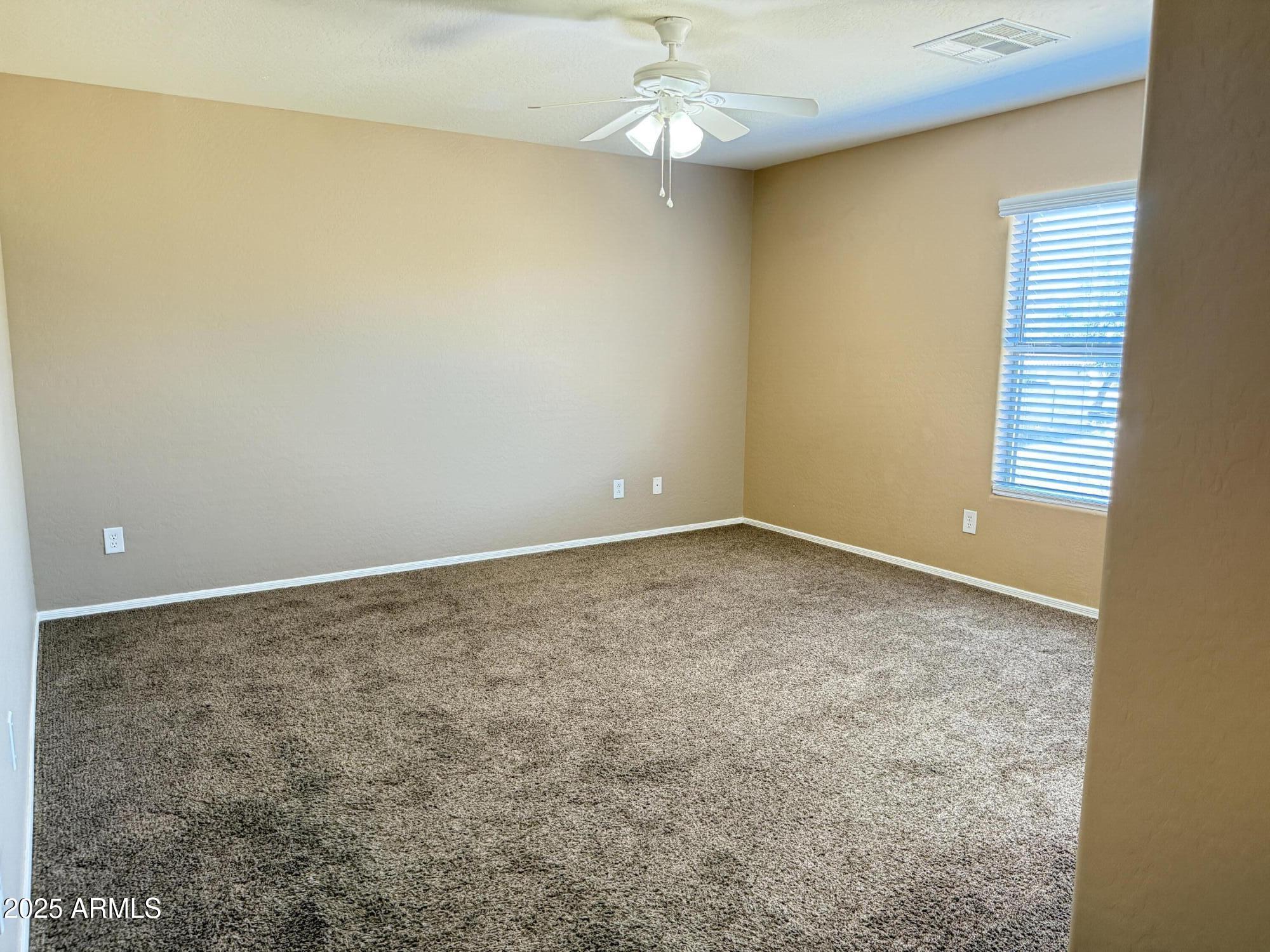 11752 West Foothill Drive Sun City, AZ 85373 - Photo 38 of 48 an empty room with a window