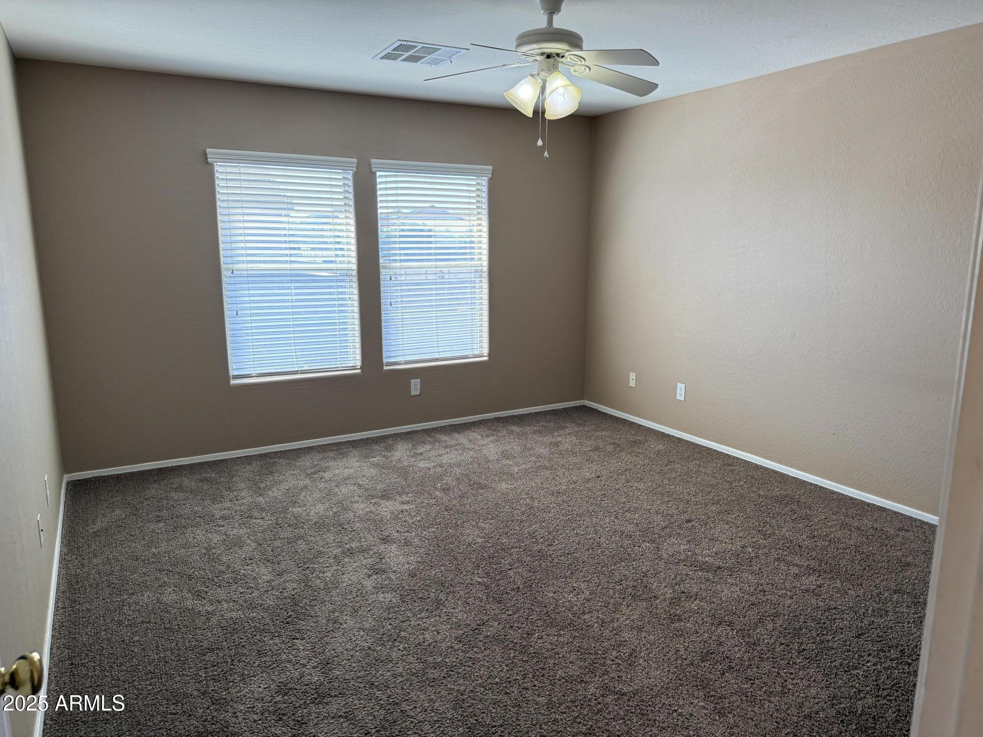 11752 West Foothill Drive Sun City, AZ 85373 - Photo 42 of 48 an empty room with a window
