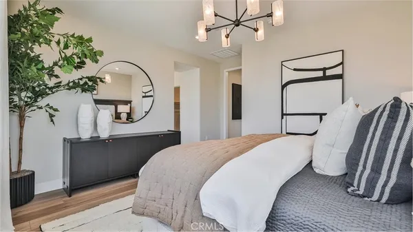 a bedroom with a bed and a dresser
