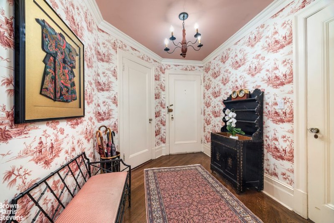 150 East 73rd Street, Unit 11B Manhattan, NY 10021 - Photo 2 of 12 a living room with furniture and a fireplace