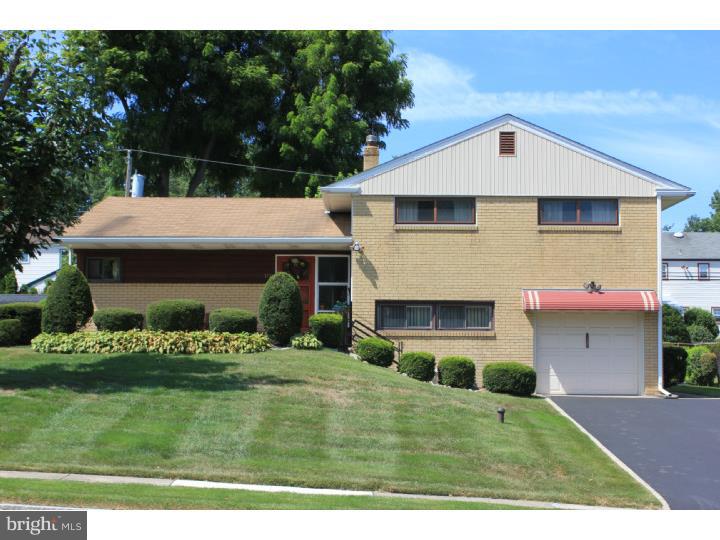 118 Harned Road Springfield, PA 19064 - Photo 1 of 25 a front view of a house with a yard