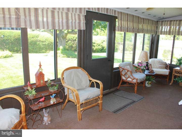 118 Harned Road Springfield, PA 19064 - Photo 16 of 25 a living room with furniture and a large window