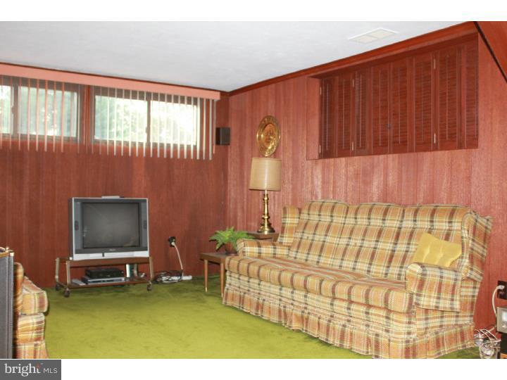 118 Harned Road Springfield, PA 19064 - Photo 17 of 25 a living room with furniture and a flat screen tv