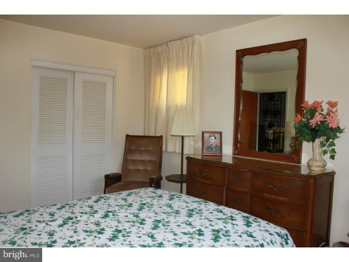 118 Harned Road Springfield, PA 19064 - Photo 20 of 25 a bedroom with a bed and a dresser