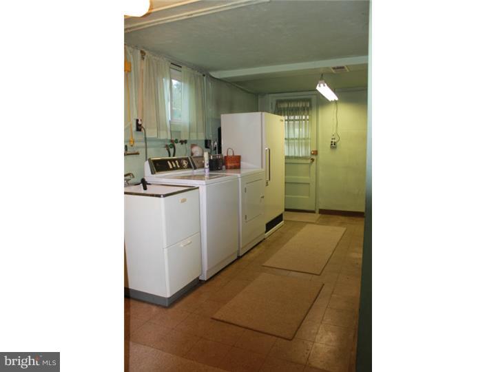 118 Harned Road Springfield, PA 19064 - Photo 23 of 25 a bathroom with a sink a toilet and shower