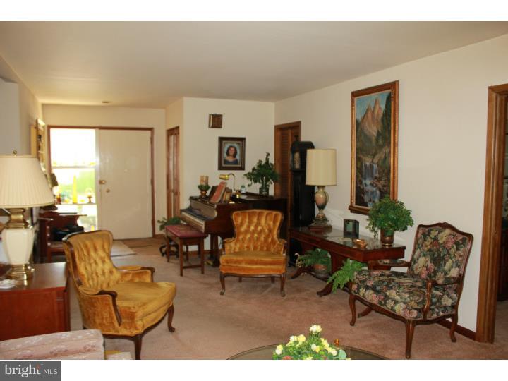 118 Harned Road Springfield, PA 19064 - Photo 10 of 25 a living room with furniture and a wooden floor