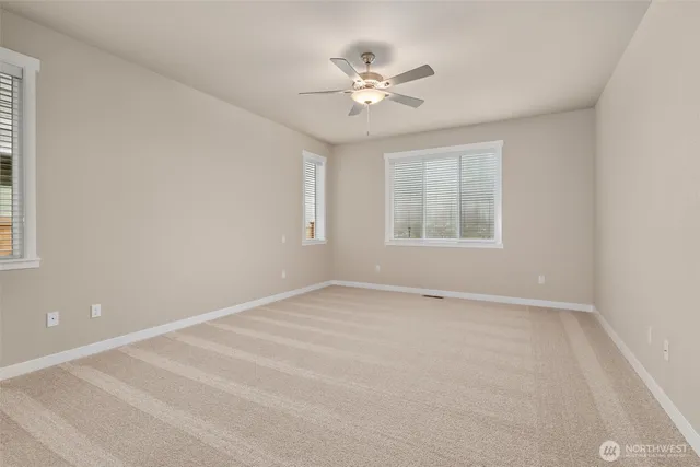 a bathroom with a double vanity sink a large mirror and a shower