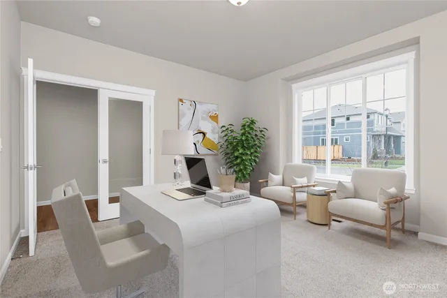 a kitchen with kitchen island a refrigerator stove microwave and cabinets