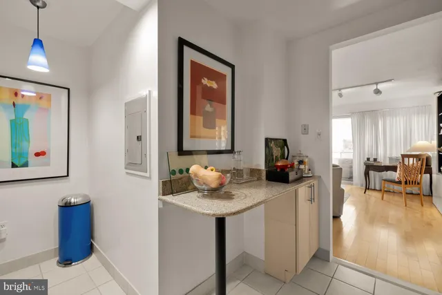 a living room with furniture and a mirror