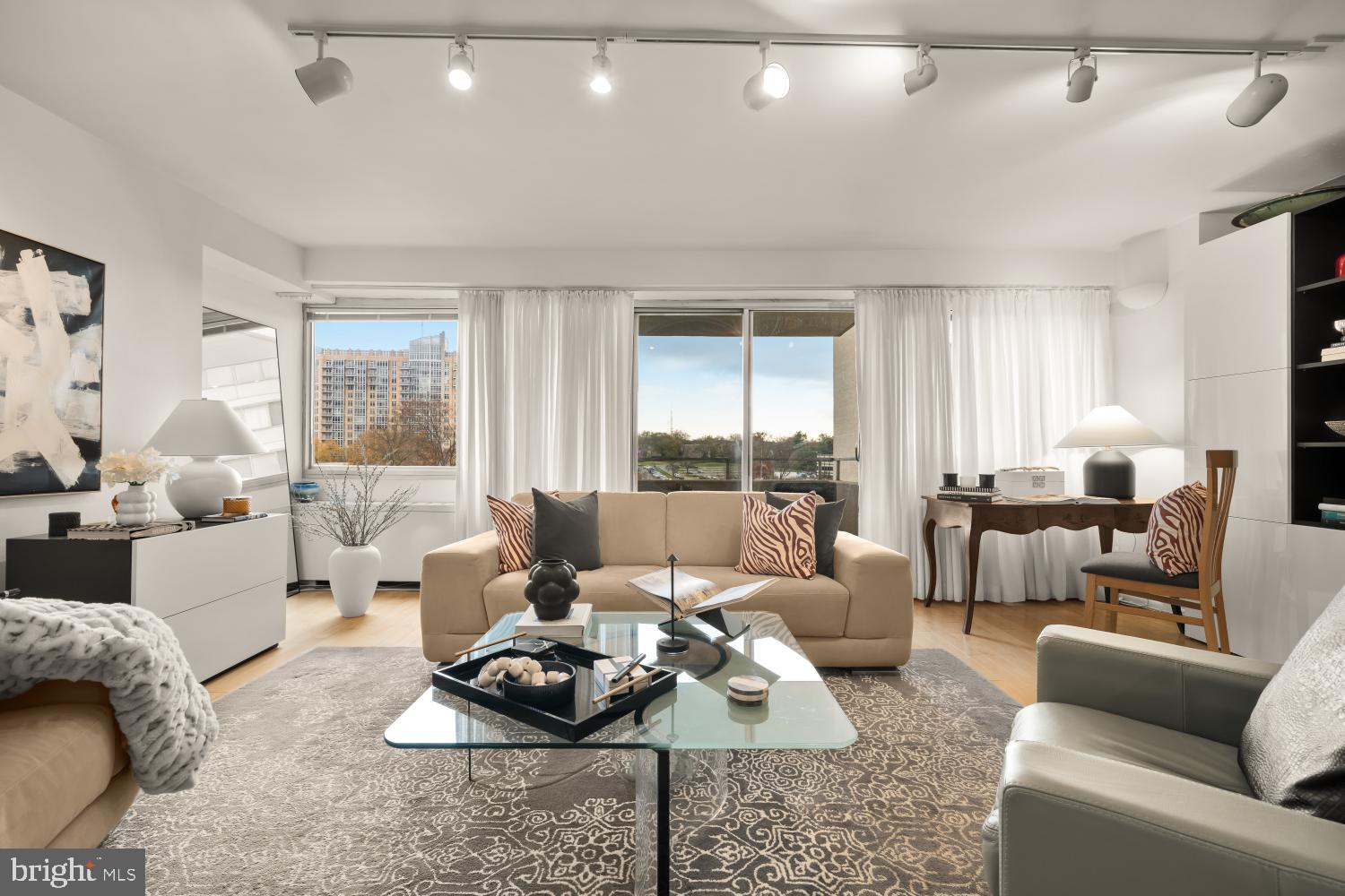 5500 Friendship Boulevard, Unit 910N Chevy Chase, MD 20815 - Photo 5 of 17 a living room with furniture and a large window