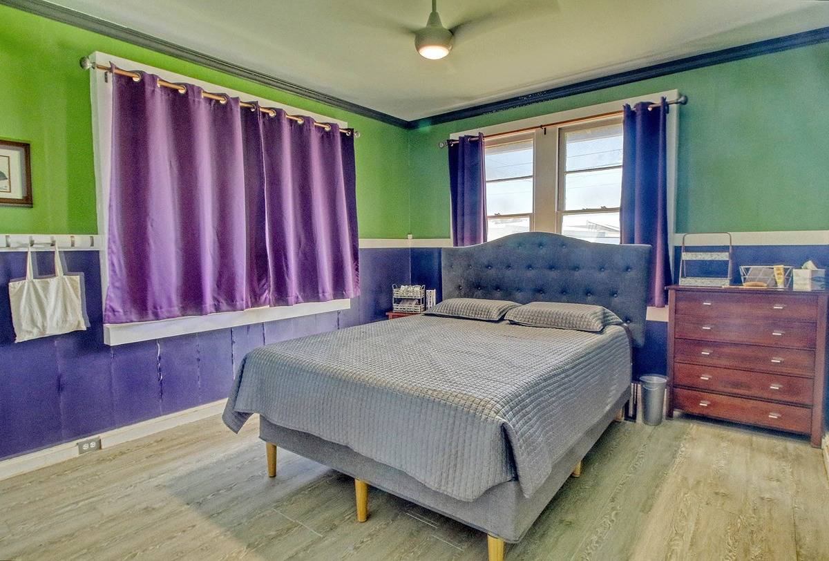 4875 Pelehu Road Kapaa, HI 96746 - Photo 8 of 15 a bed sitting in a spacious bedroom next to a window