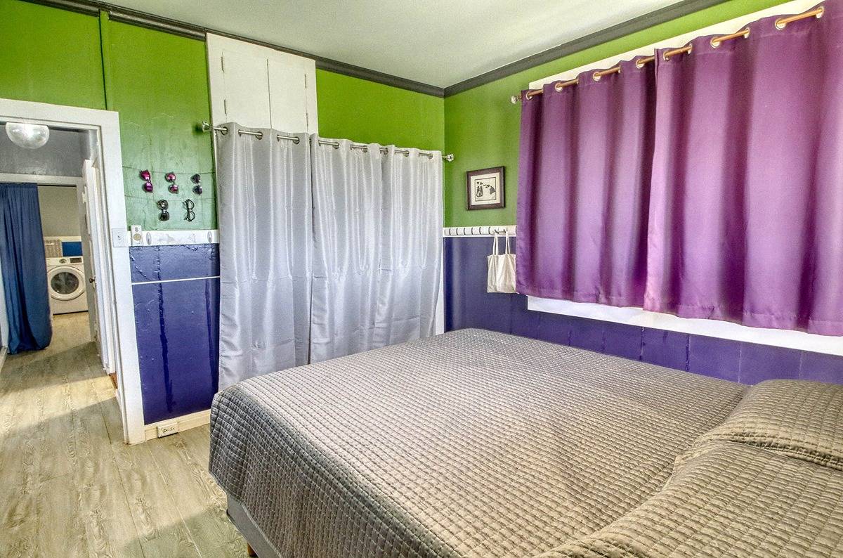 4875 Pelehu Road Kapaa, HI 96746 - Photo 9 of 15 a bed room with a bed and a chair