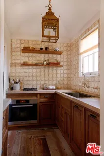 a living room filled with furniture and a large window