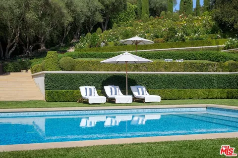 a view of lake with a swimming pool and sitting area