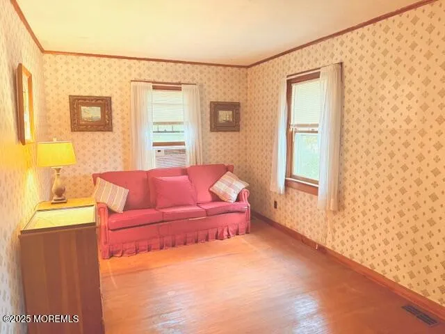 a spacious bedroom with a bed and a window