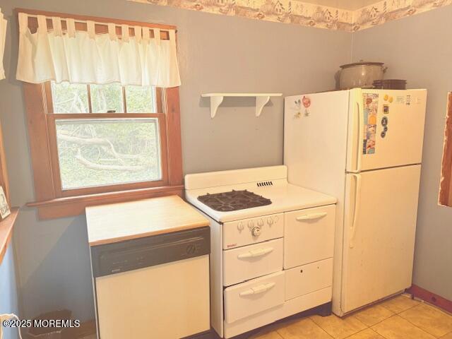 139 Walnut Drive Brick, NJ 08724 - Photo 5 of 15 a white refrigerator freezer and a stove sitting inside of a kitchen