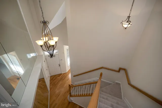 a view of a house with a yard and potted plants
