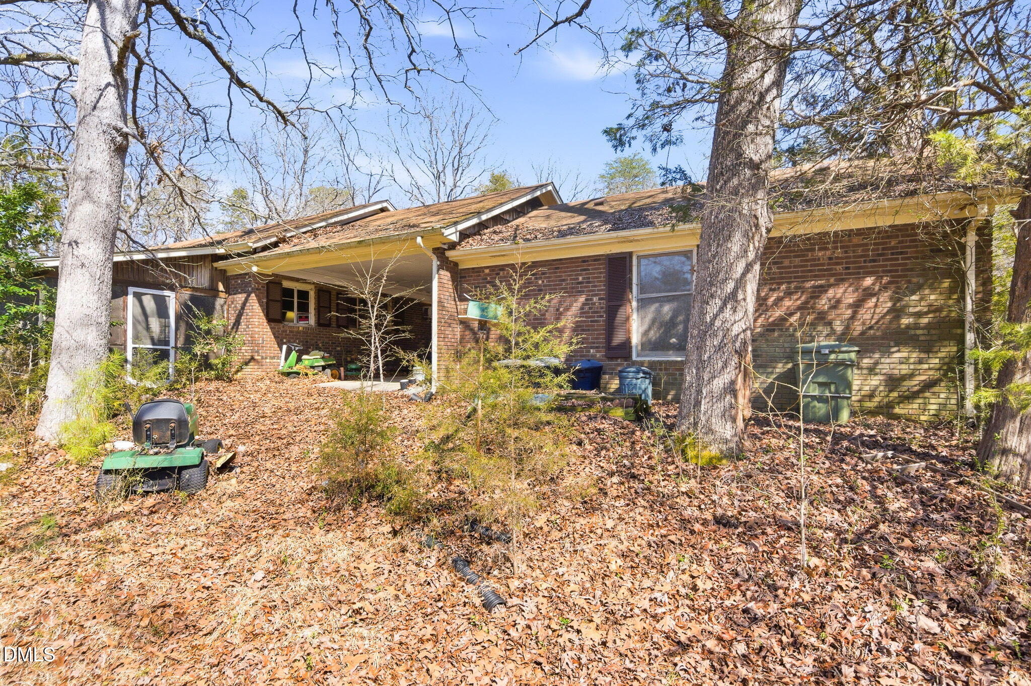 1603 Sykes Road Mebane, NC 27302 - Photo 35 of 45 a view of a patio with a table and chairs under an umbrella