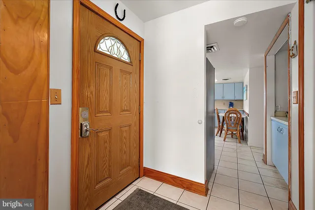a kitchen with a stove top oven sink and cabinets