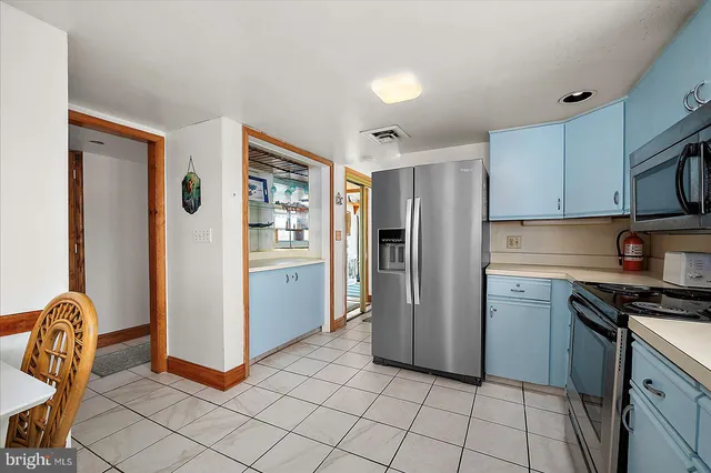 a bedroom with a bed and a dresser in it